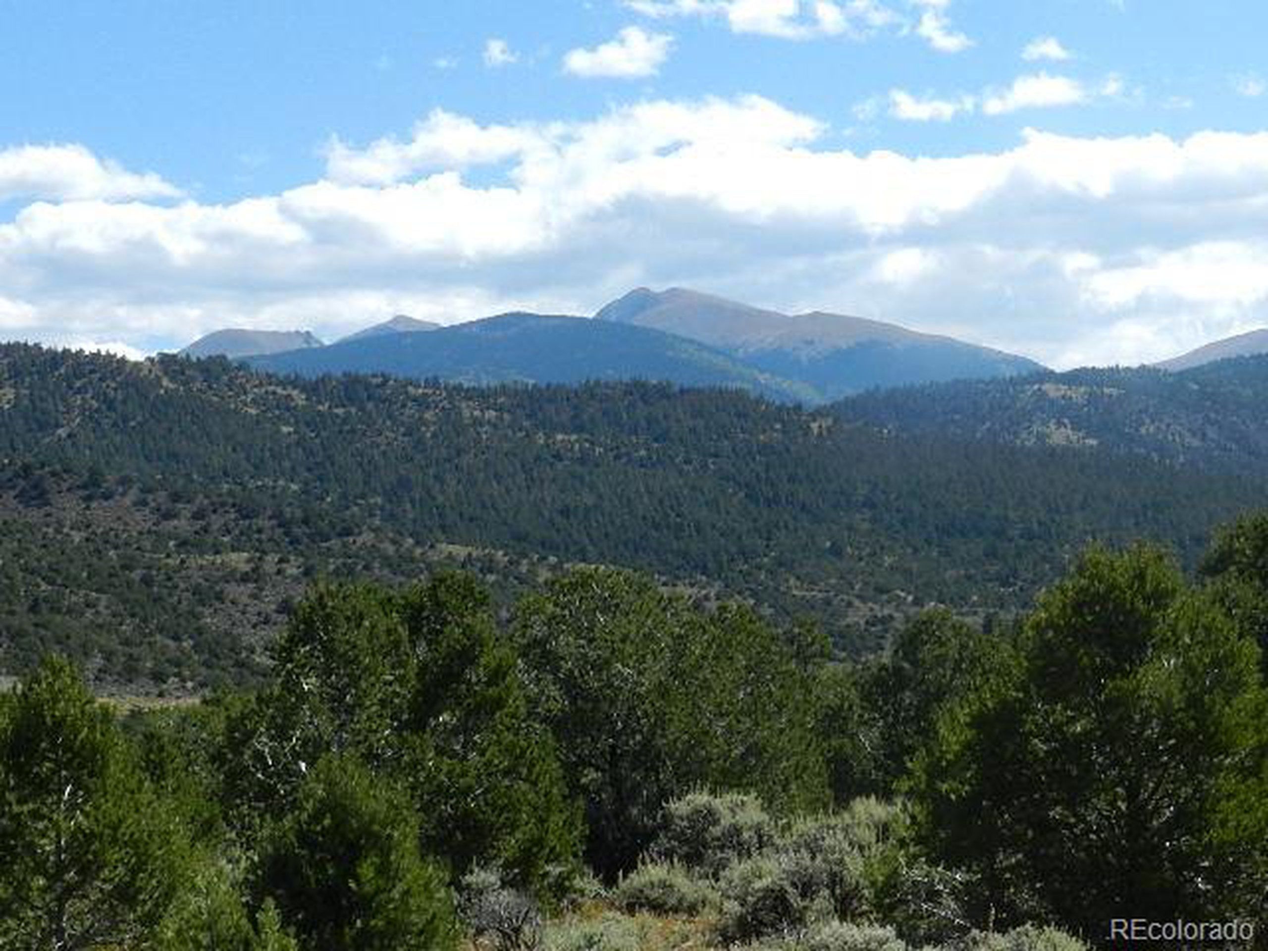 8 Mountain Ridge Lane San Luis, CO 81152 - Photo 26 of 28 a view of a house with a mountain in the background