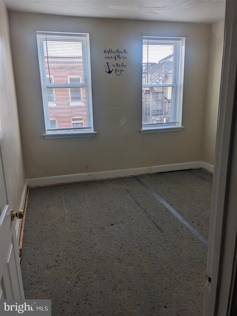 1622 Patapsco Street Baltimore, MD 21230 - Photo 6 of 6 an empty room with windows