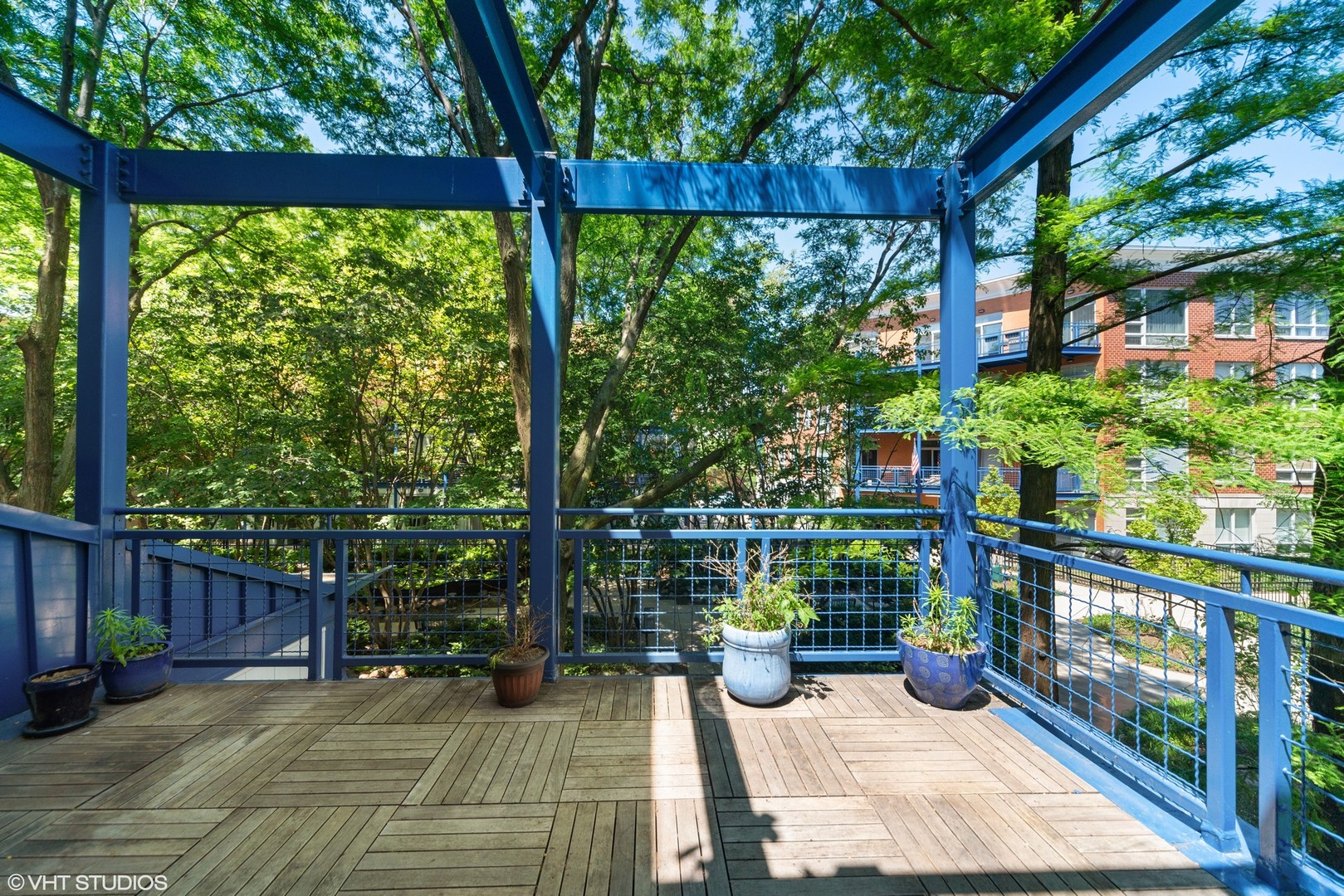 26 North May Street, Unit 322 Chicago, IL 60607 - Photo 13 of 31 a view of a balcony with wooden floor
