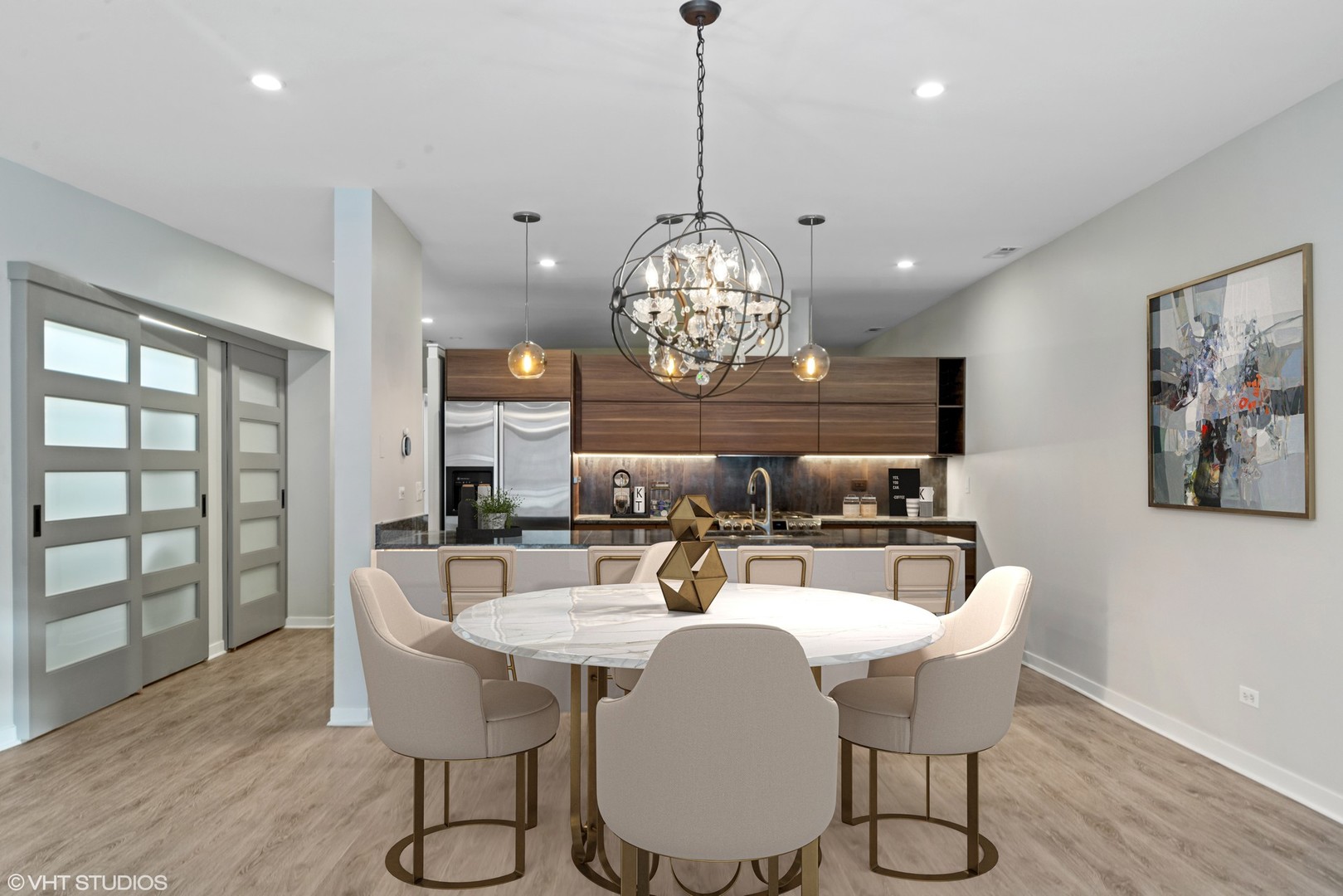 26 North May Street, Unit 322 Chicago, IL 60607 - Photo 14 of 31 a view of a dining room with furniture a chandelier and wooden floor