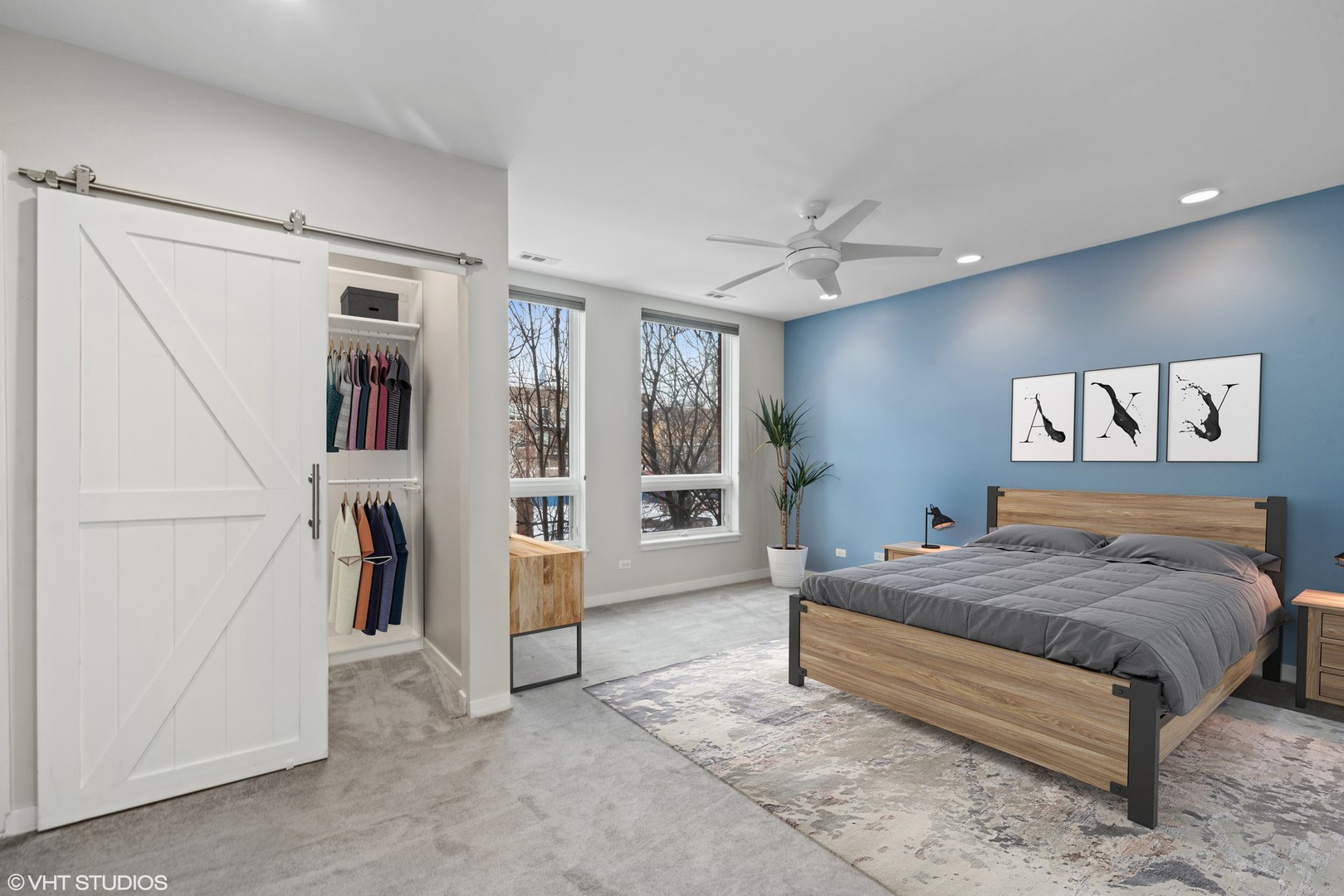 26 North May Street, Unit 322 Chicago, IL 60607 - Photo 18 of 31 a bedroom with a bed and a large mirror