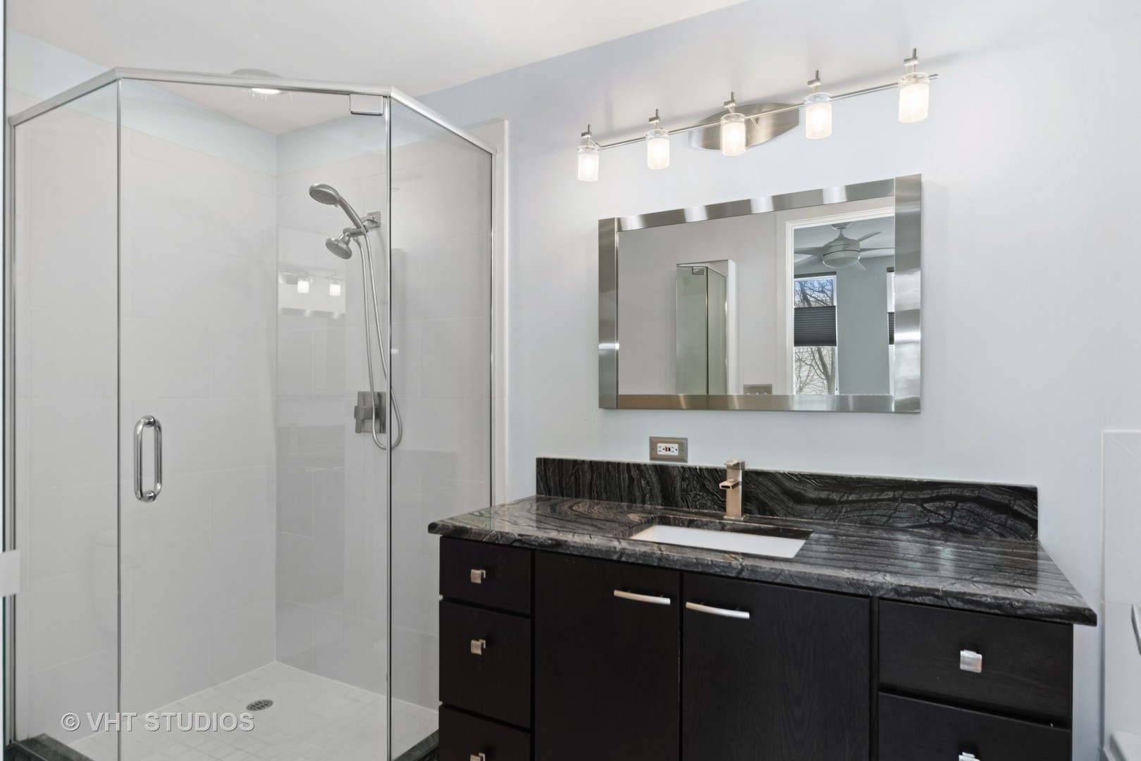 26 North May Street, Unit 322 Chicago, IL 60607 - Photo 23 of 31 a bathroom with a granite countertop sink shower and a mirror
