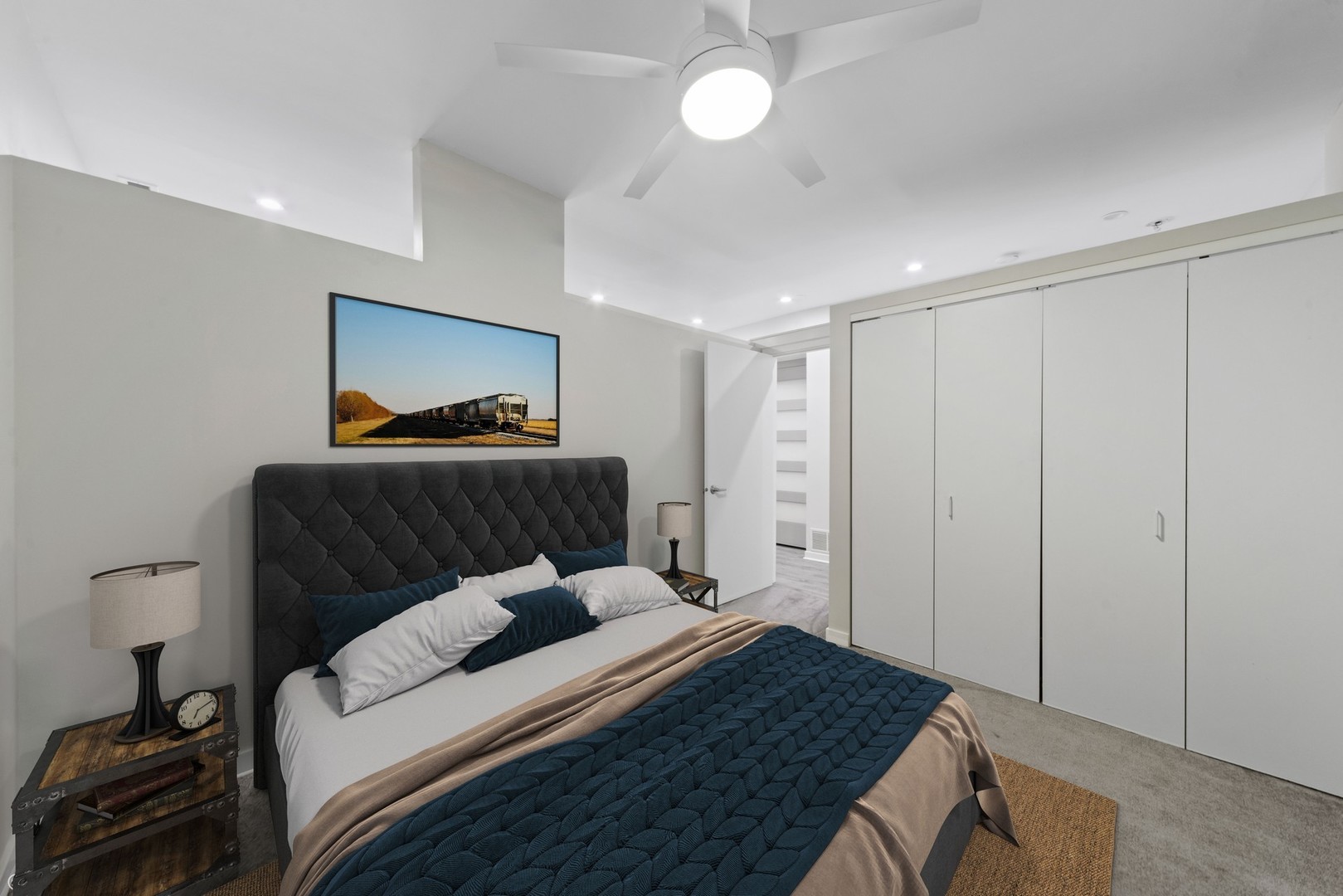 26 North May Street, Unit 322 Chicago, IL 60607 - Photo 25 of 31 a bedroom with a bed and a chandelier