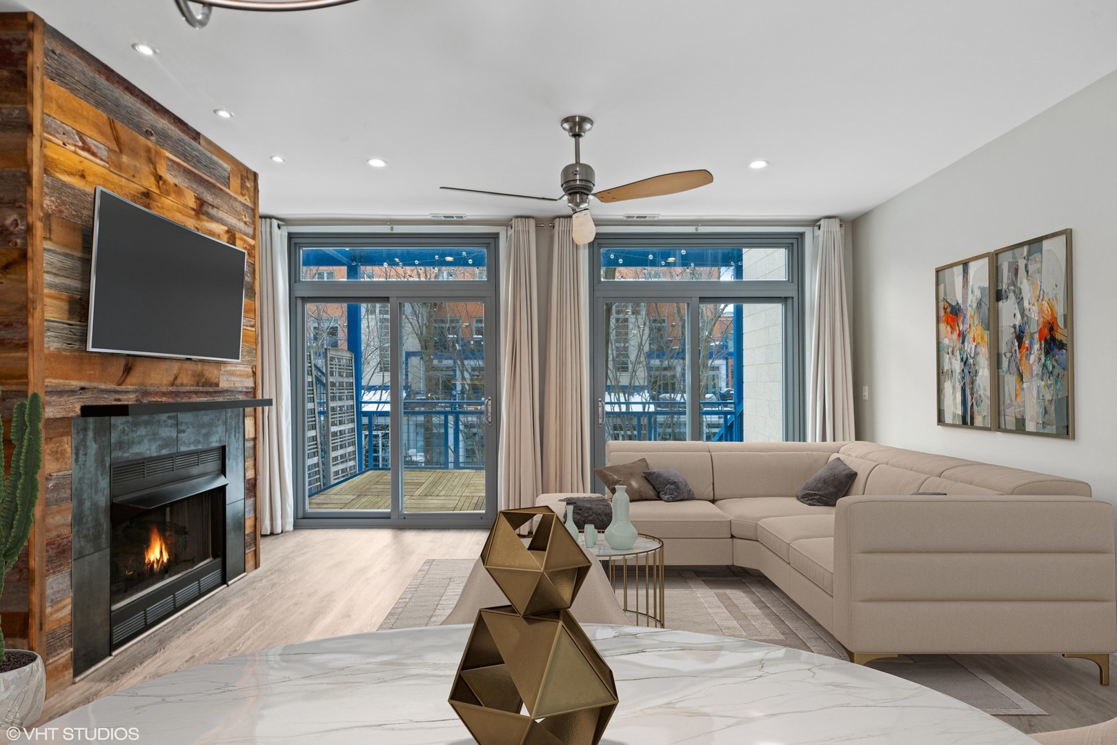 26 North May Street, Unit 322 Chicago, IL 60607 - Photo 8 of 31 a living room with furniture a fireplace and a flat screen tv