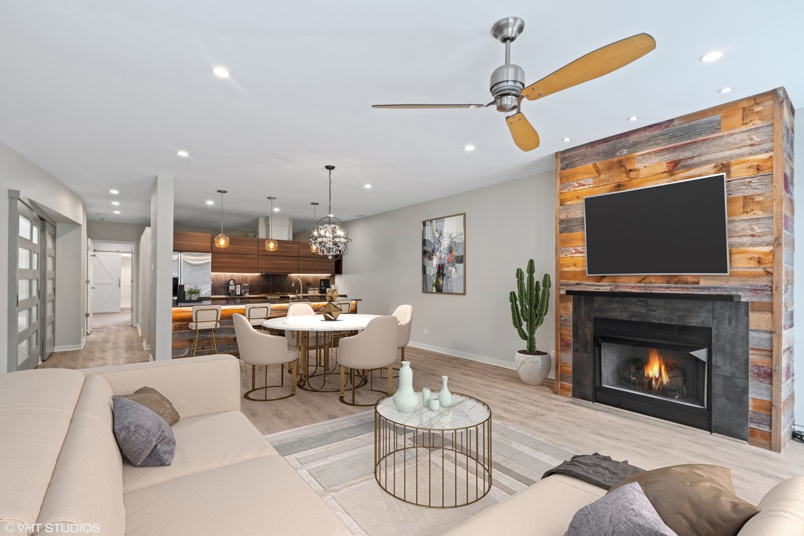 26 North May Street, Unit 322 Chicago, IL 60607 - Photo 10 of 31 a living room with furniture a flat screen tv and a fireplace