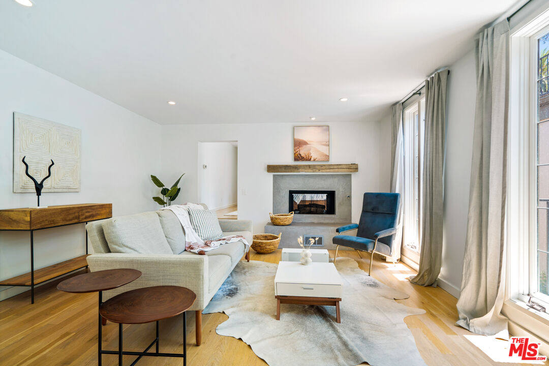 373 Mesa Road Santa Monica, CA 90402 - Photo 17 of 25 a living room with furniture and a fireplace