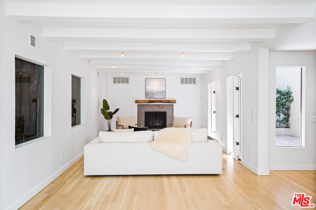 373 Mesa Road Santa Monica, CA 90402 - Photo 3 of 25 a living room with furniture and a fireplace