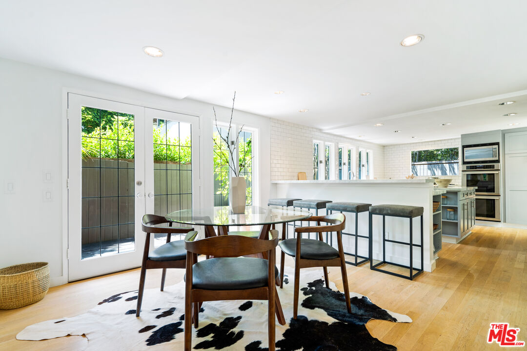 373 Mesa Road Santa Monica, CA 90402 - Photo 8 of 25 a view of a dining room with furniture window and outside view