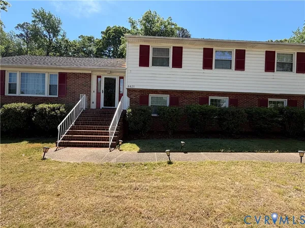 a view of house with yard