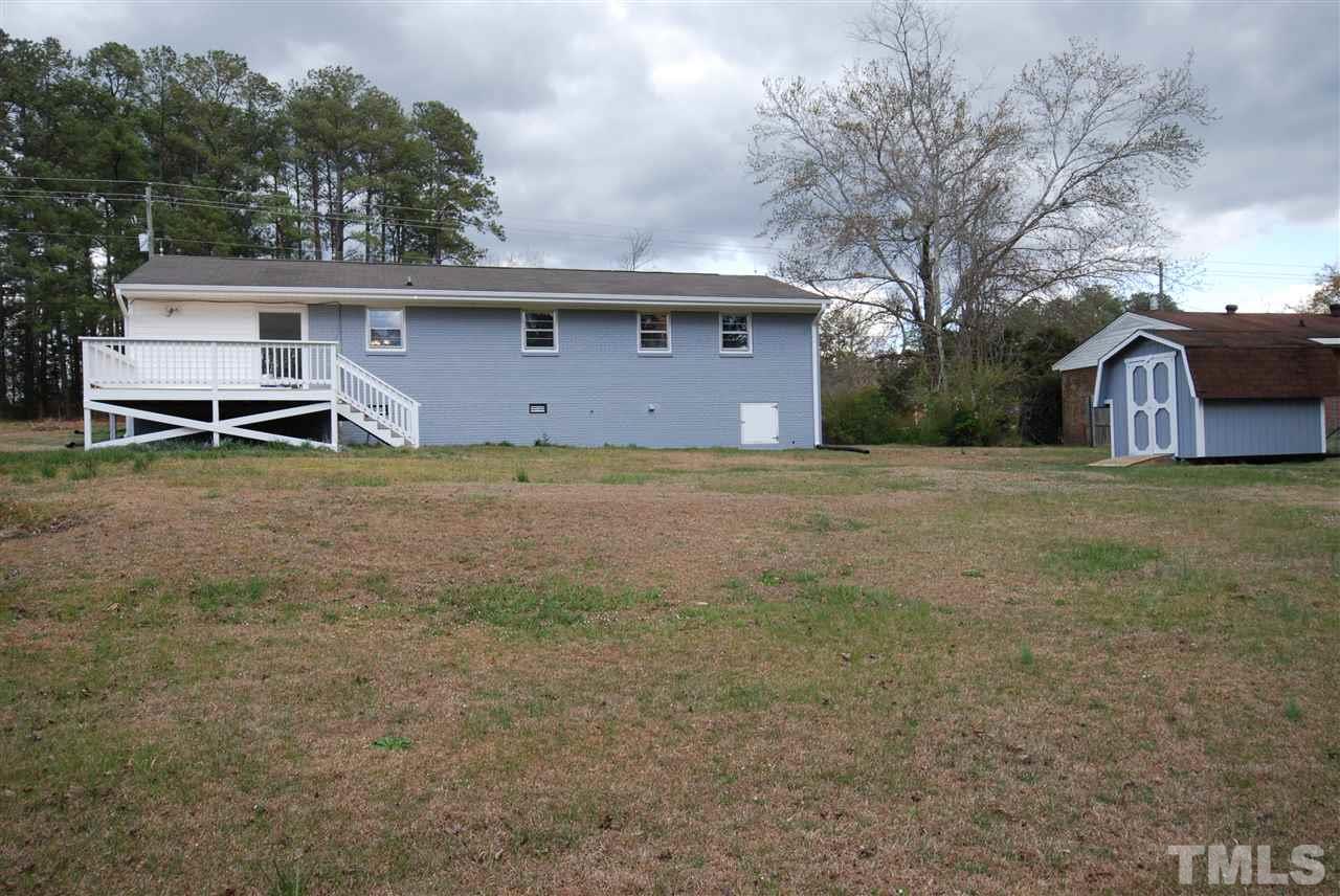 6408 Rock Quarry Road Raleigh, NC 27610 - Photo 21 of 22 Huge back yard perfect for entertaining, with storage building.