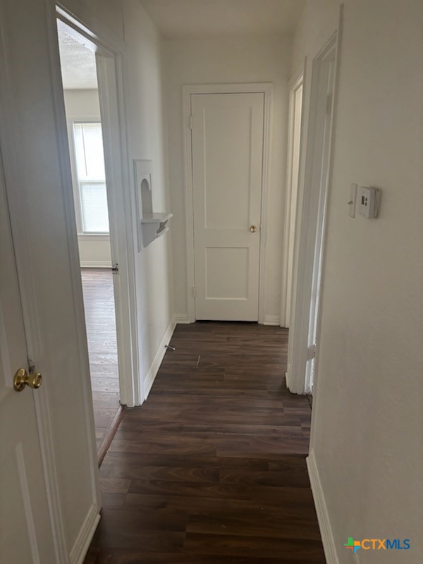 1206 Middleton Street Killeen, TX 76541 - Photo 3 of 6 a view of a hallway with wooden floor and closet area