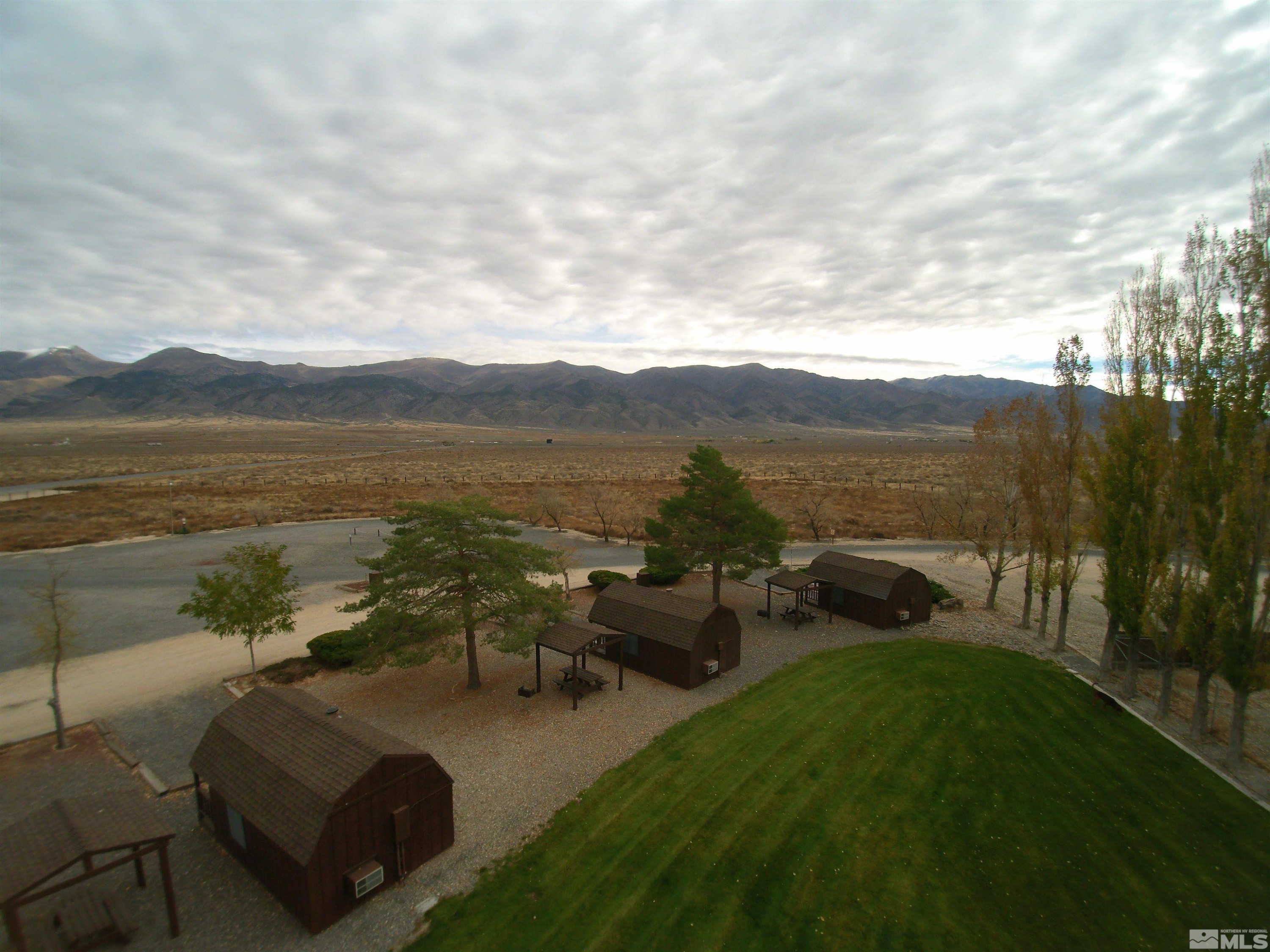 11555 Brooks Canyon Road Lovelock, NV 89419 - Photo 15 of 27 a view of a lake with lawn chairs