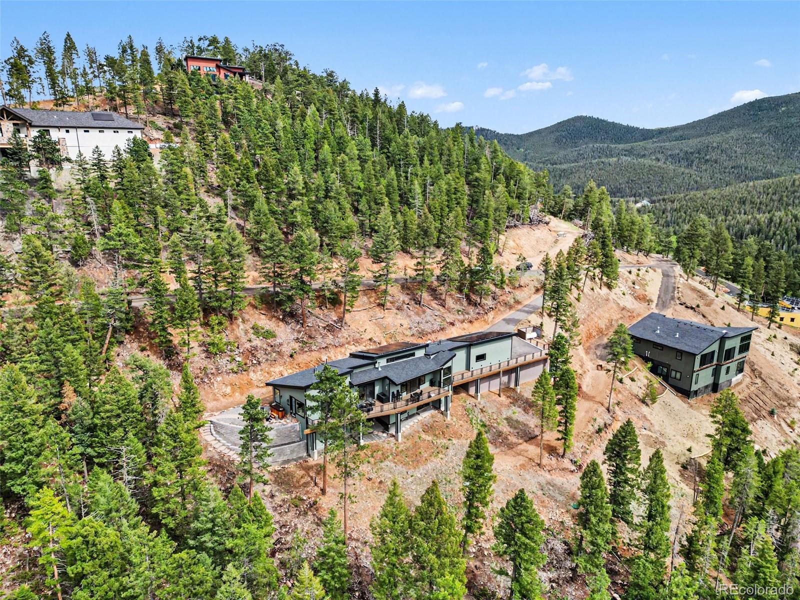 7231 Timber Trail Road Evergreen, CO 80439 - Photo 34 of 35 a view of a lake with a mountain