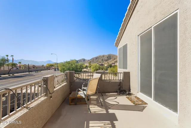 a view of a terrace with couches and sky view