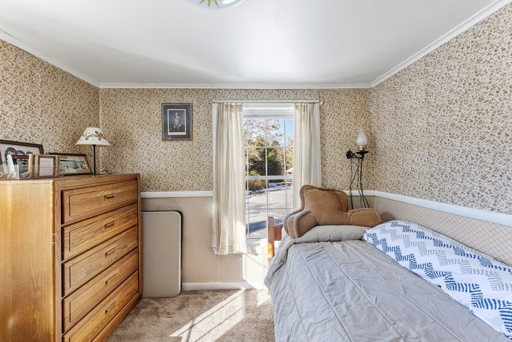 115 Kennedy Road Stoughton, MA 02072 - Photo 24 of 42 a bedroom with a bed and a dresser