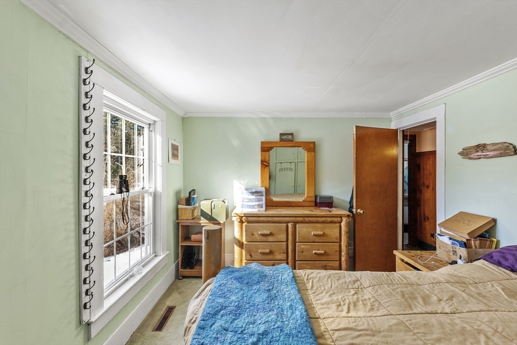 115 Kennedy Road Stoughton, MA 02072 - Photo 26 of 42 a bedroom with a bed and a dresser