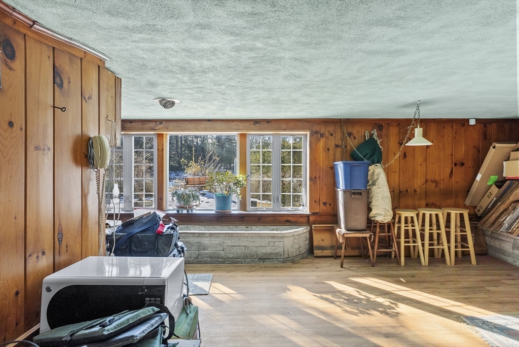 115 Kennedy Road Stoughton, MA 02072 - Photo 34 of 42 a living room with furniture and a floor to ceiling window