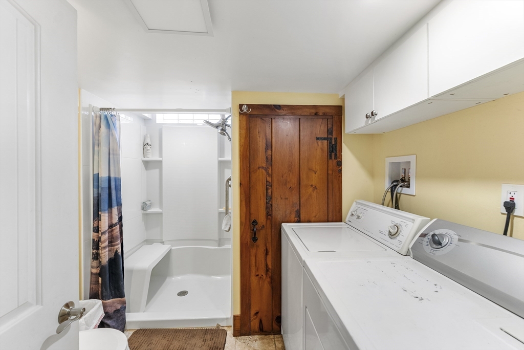 115 Kennedy Road Stoughton, MA 02072 - Photo 35 of 42 a bathroom with a tub sink and mirror