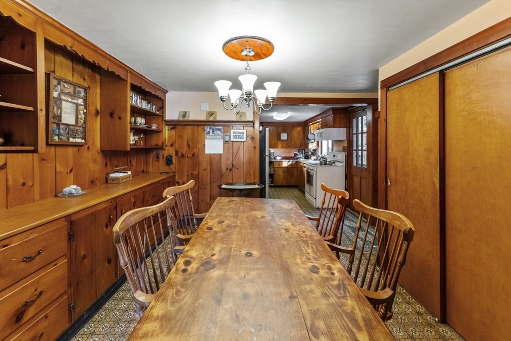 115 Kennedy Road Stoughton, MA 02072 - Photo 10 of 42 a view of a hallway with a chandelier