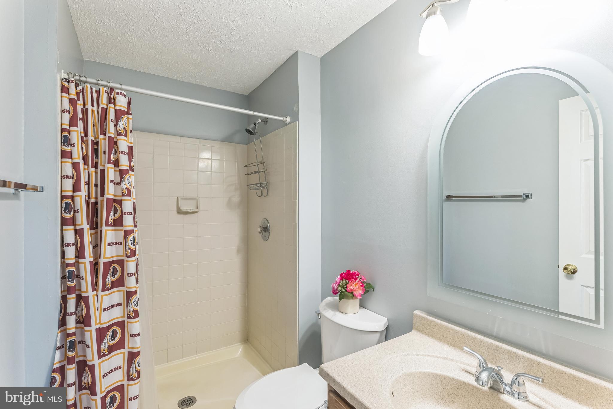 5620 Denton Court Frederick, MD 21703 - Photo 15 of 33 a bathroom with a sink toilet and shower