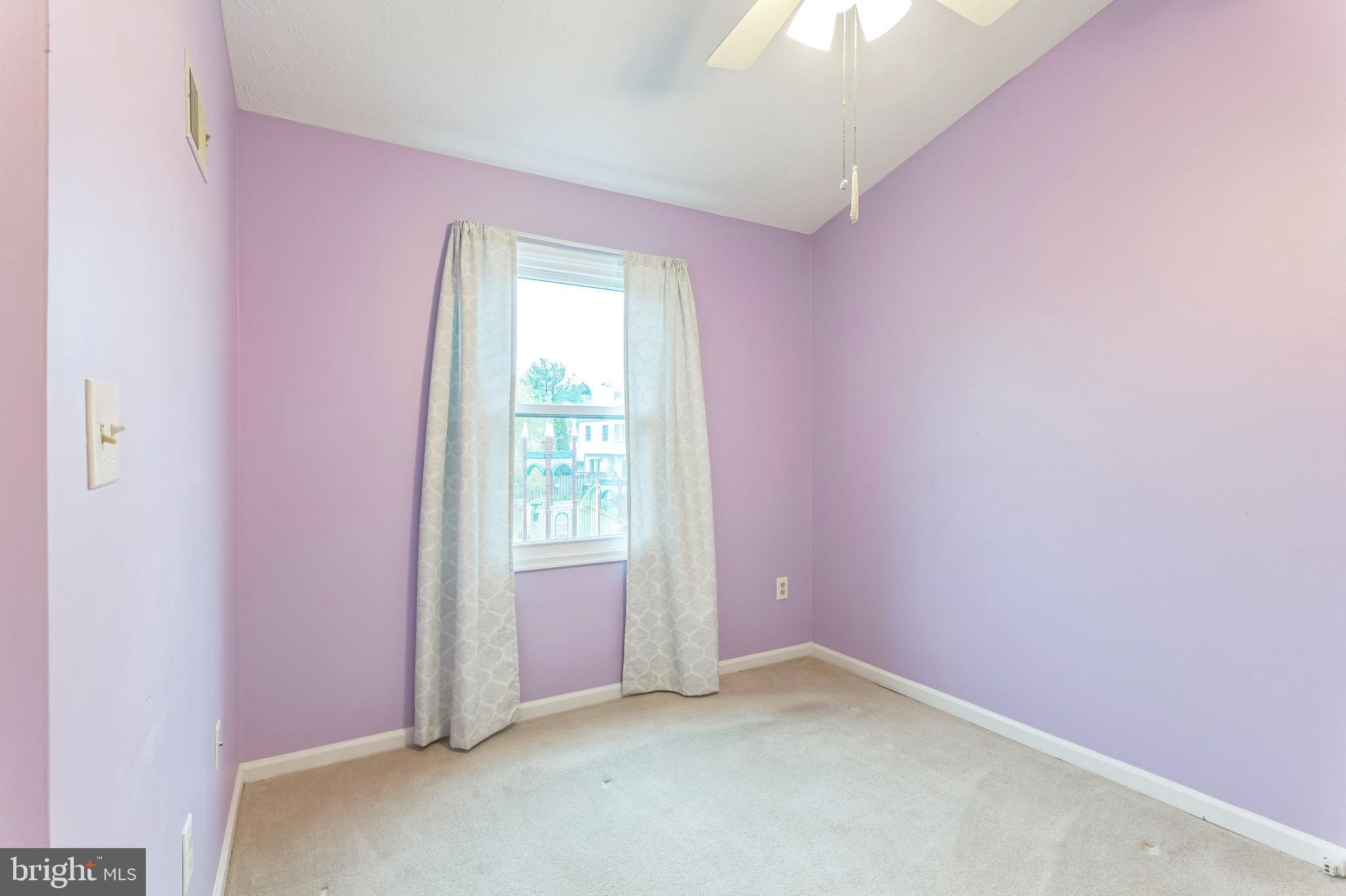 5620 Denton Court Frederick, MD 21703 - Photo 16 of 33 an empty room with a windows and chandelier fan