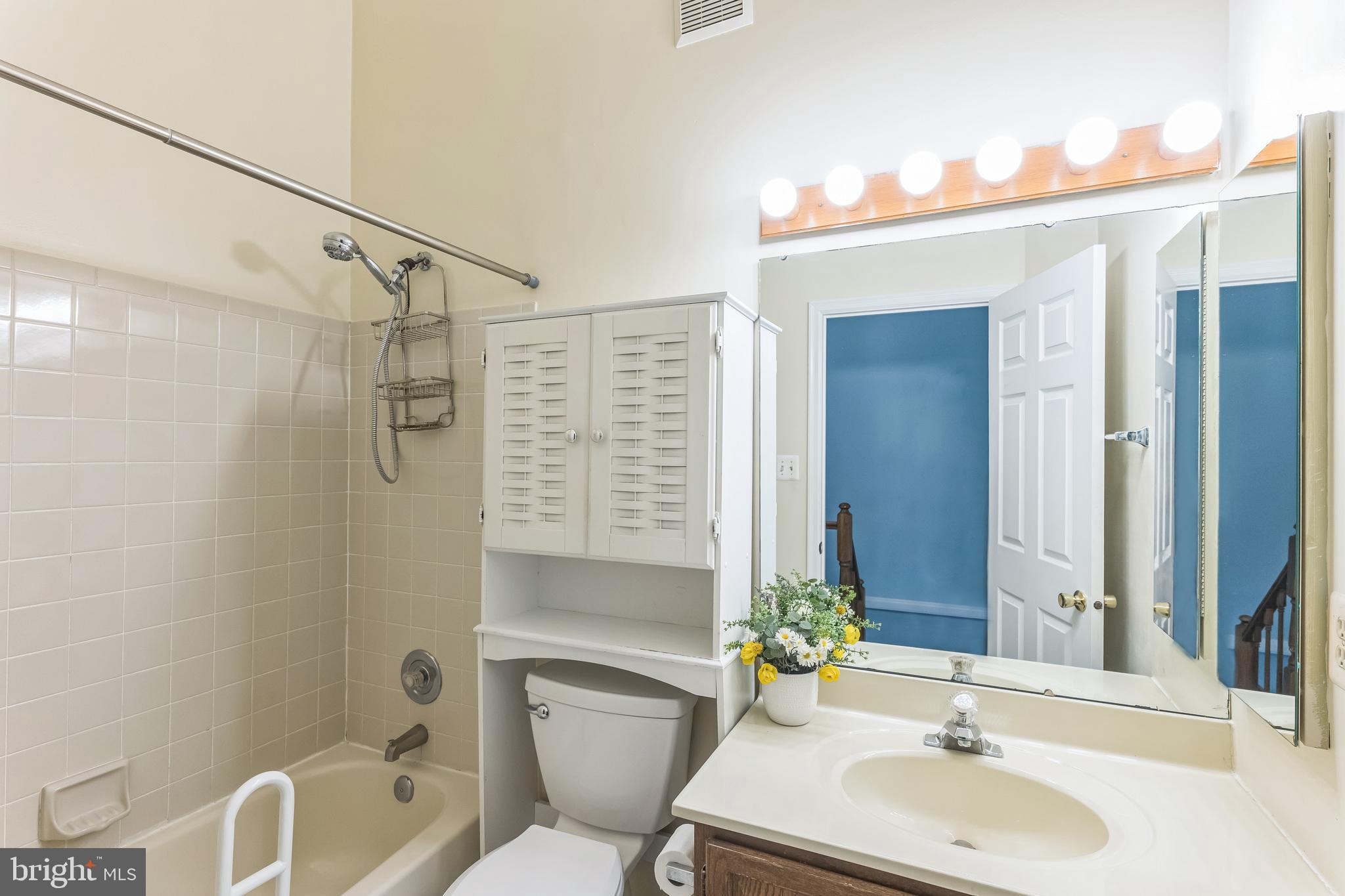 5620 Denton Court Frederick, MD 21703 - Photo 21 of 33 a bathroom with a sink toilet tub and shower