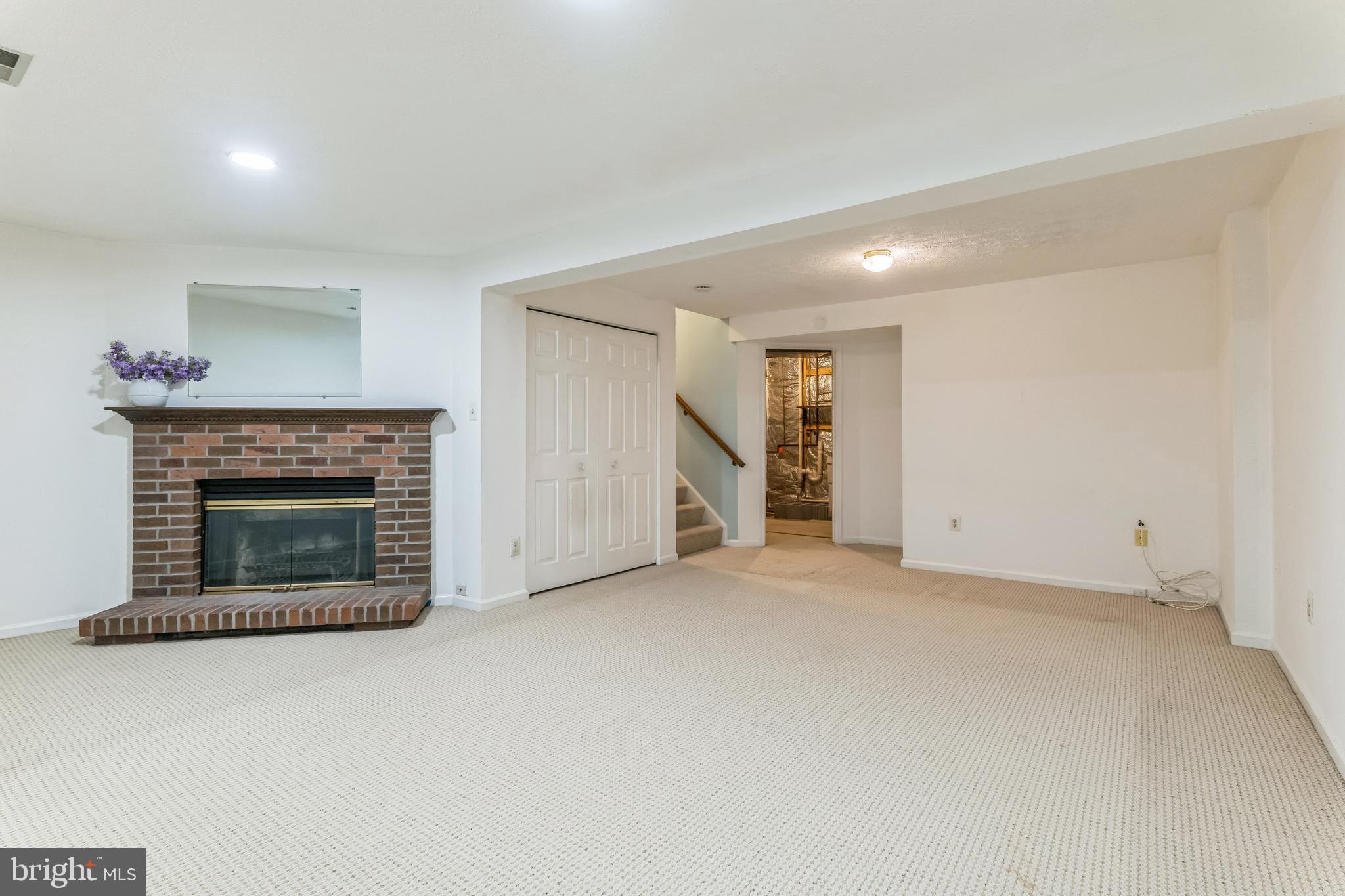 5620 Denton Court Frederick, MD 21703 - Photo 22 of 33 a view of empty room with a fireplace