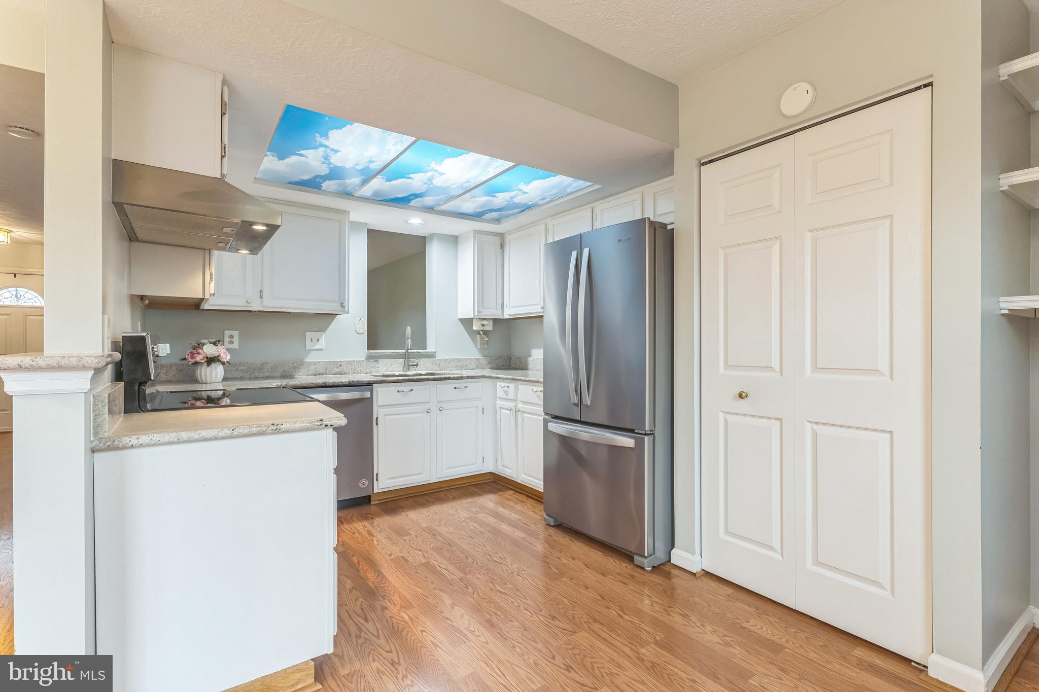 5620 Denton Court Frederick, MD 21703 - Photo 3 of 33 a kitchen with stainless steel appliances granite countertop a refrigerator and a stove top oven