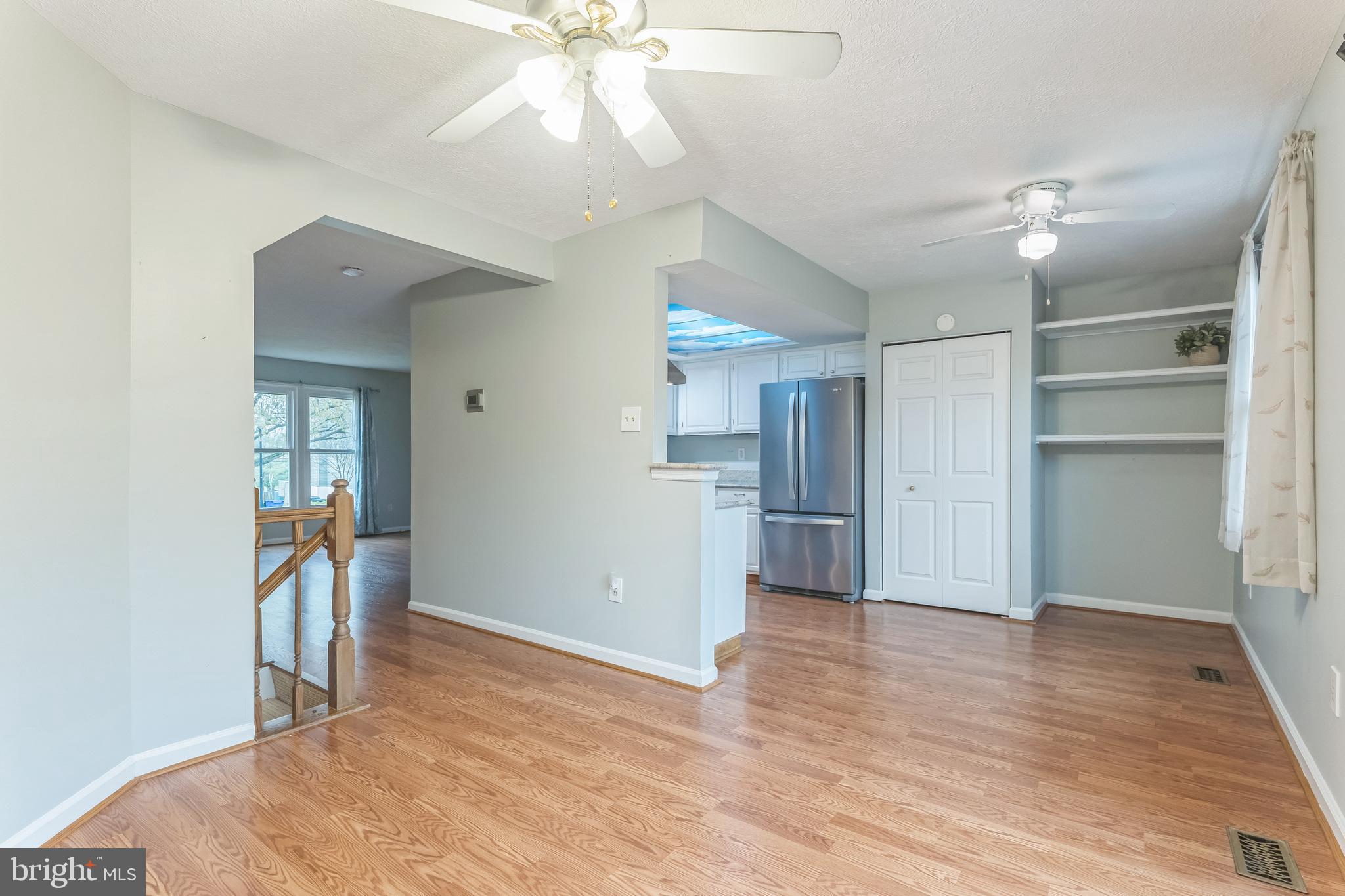 5620 Denton Court Frederick, MD 21703 - Photo 6 of 33 a view of empty room with wooden floor and ceiling fan