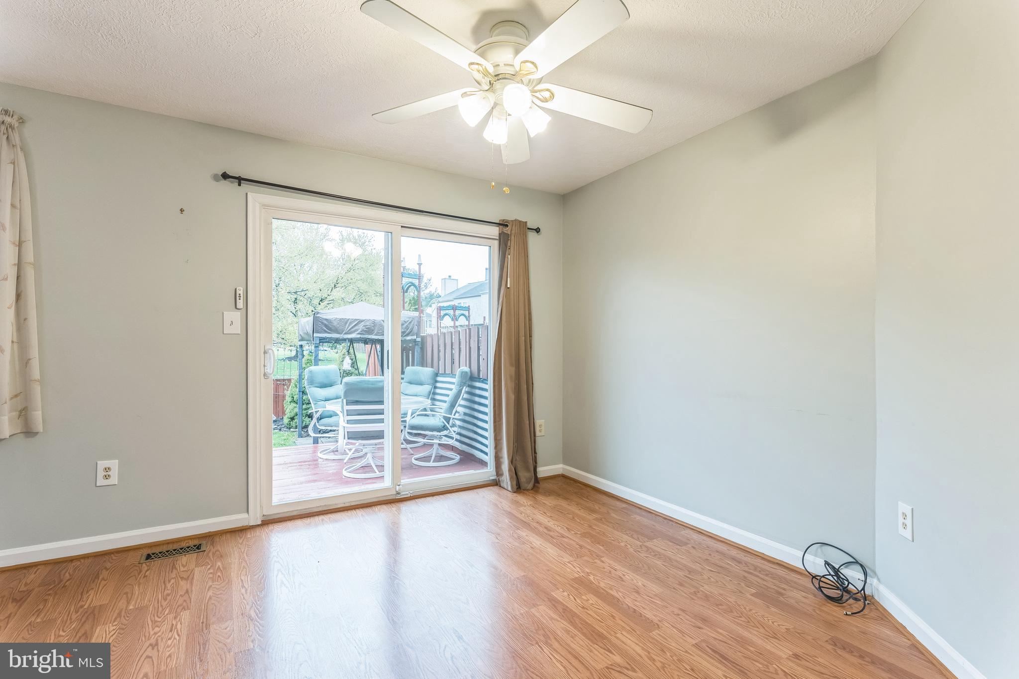 5620 Denton Court Frederick, MD 21703 - Photo 8 of 33 wooden floor in an empty room with a window