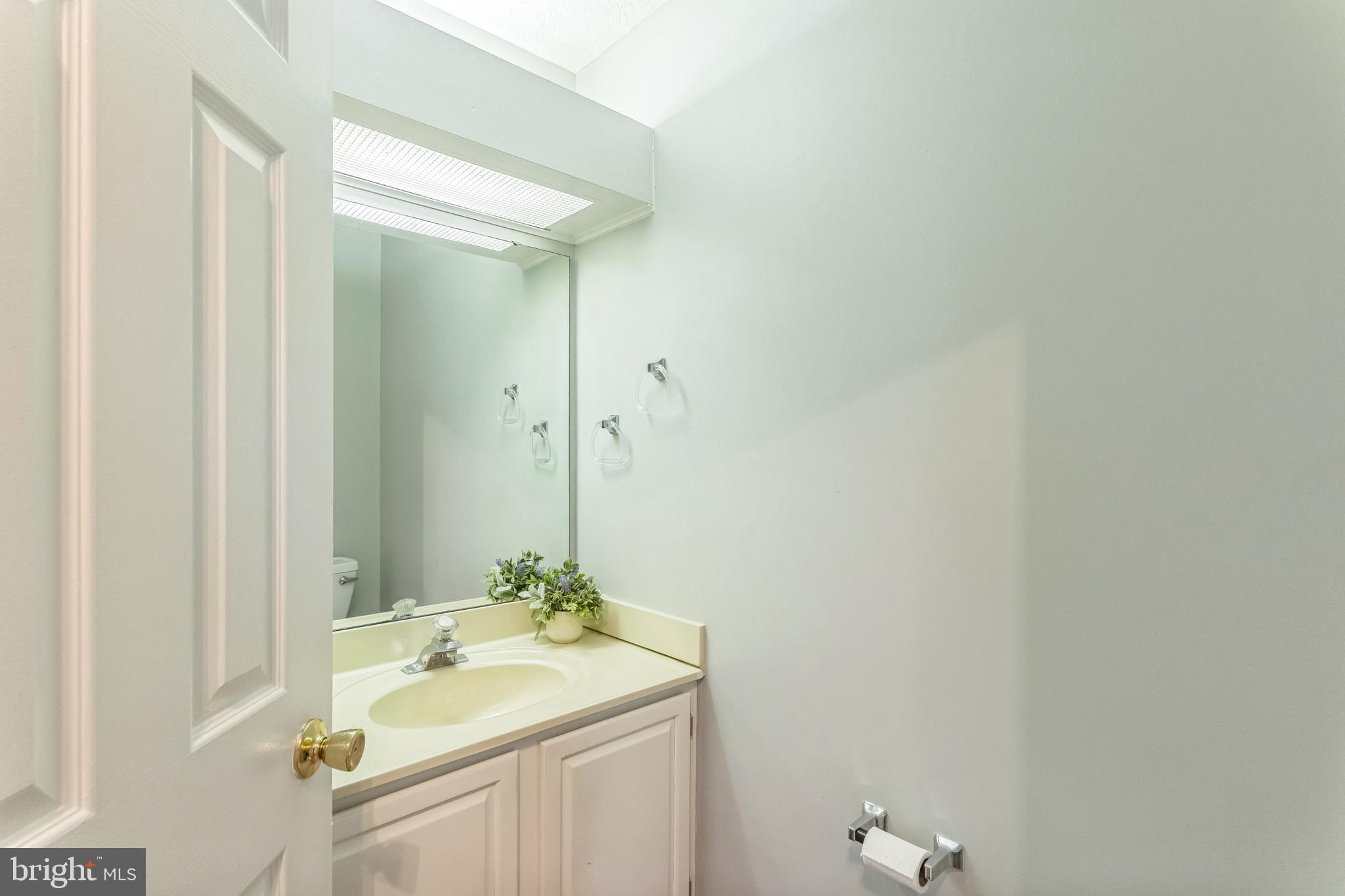 5620 Denton Court Frederick, MD 21703 - Photo 9 of 33 a bathroom with a sink and a mirror
