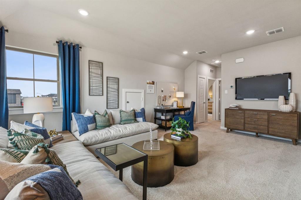 9505 Rattlesnake Trail Crowley, TX 76036 - Photo 21 of 33 a living room with furniture and a flat screen tv