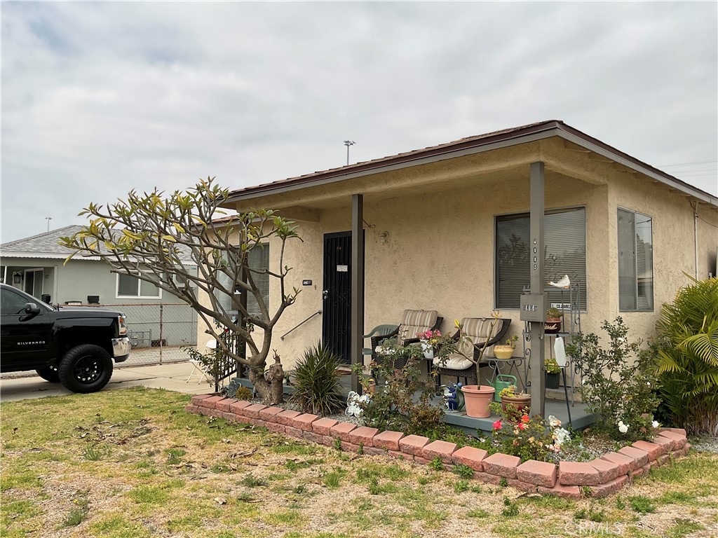 5007 Astor Avenue Commerce, CA 90040 - Photo 17 of 64 a view of a house with a yard