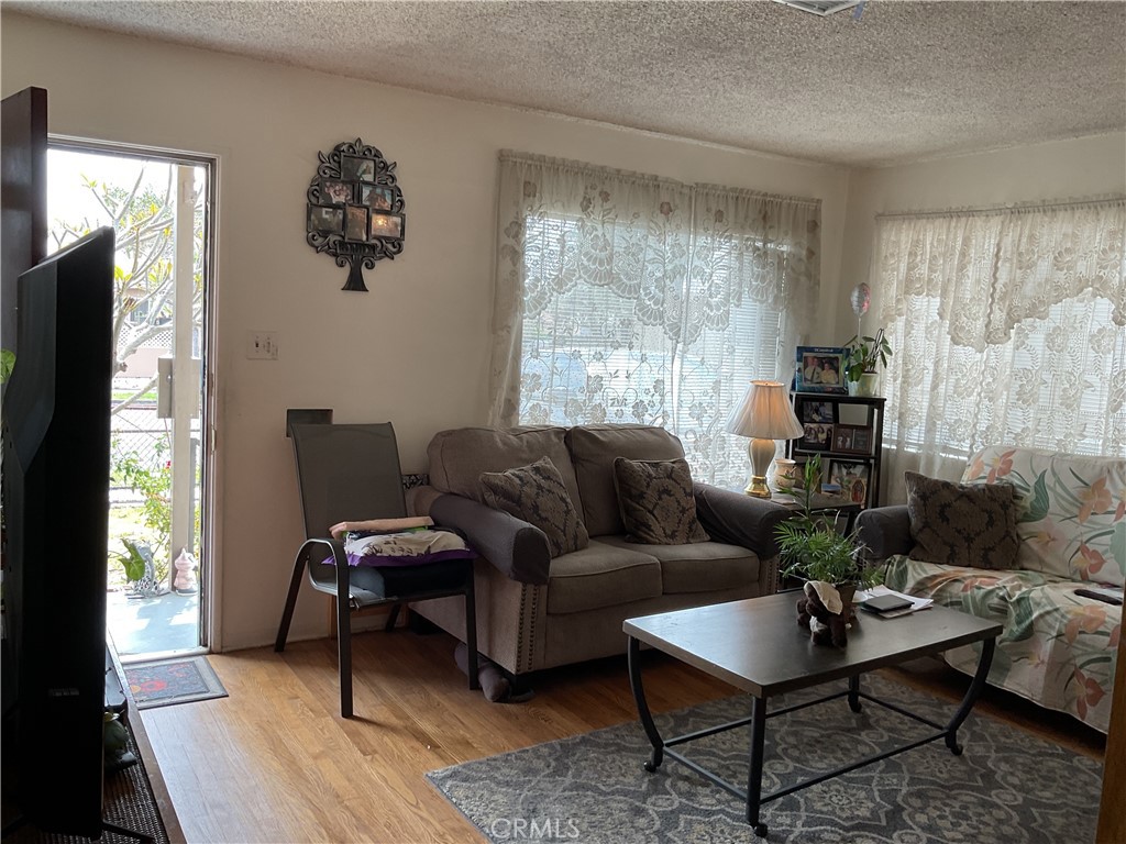 5007 Astor Avenue Commerce, CA 90040 - Photo 19 of 64 a living room with furniture and a window