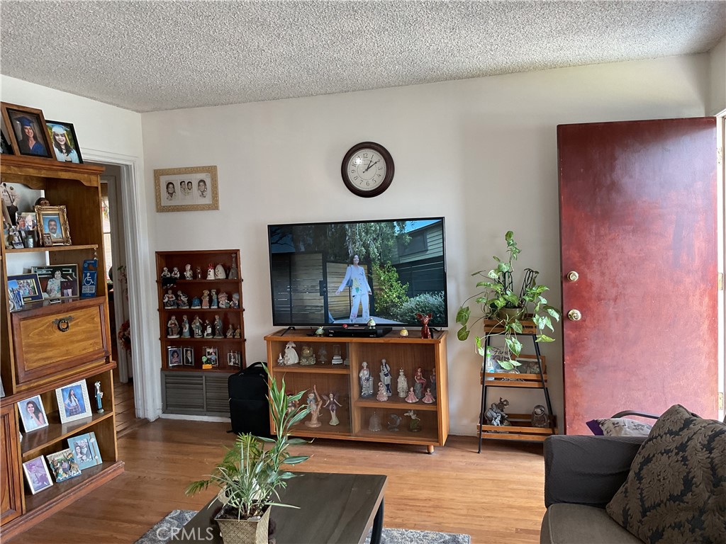 5007 Astor Avenue Commerce, CA 90040 - Photo 20 of 64 a living room with furniture and a flat screen tv