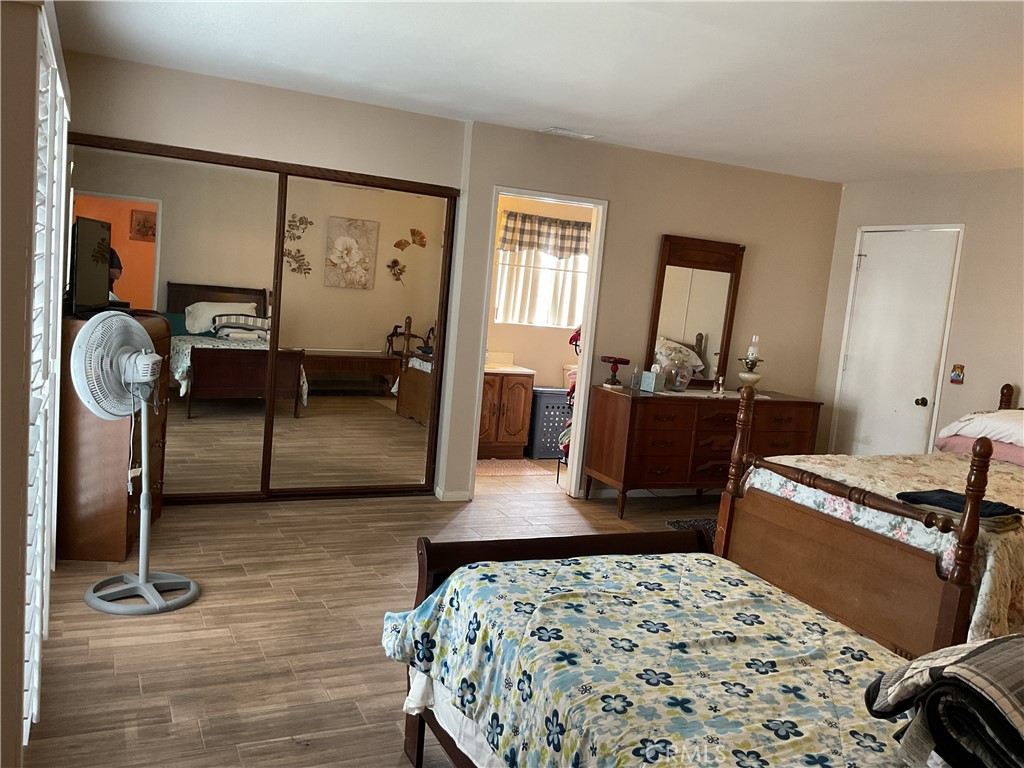 5007 Astor Avenue Commerce, CA 90040 - Photo 25 of 64 a bedroom with furniture and a wooden floor