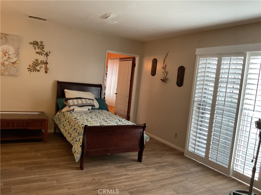 5007 Astor Avenue Commerce, CA 90040 - Photo 28 of 64 a bedroom with a bed and a window