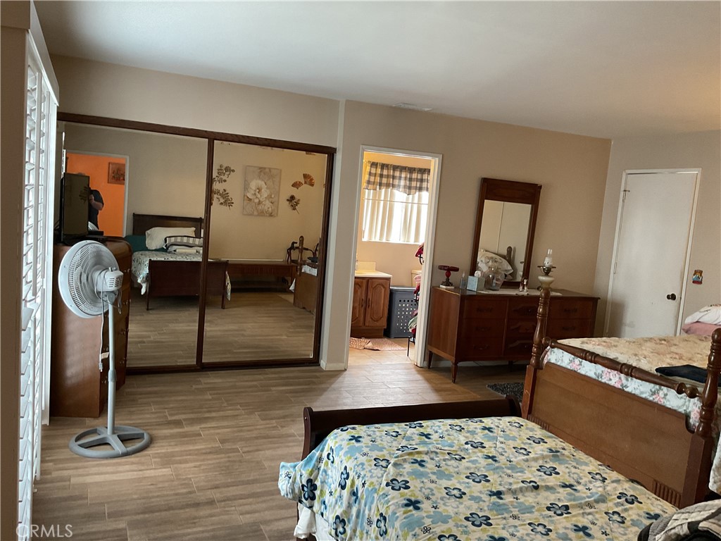 5007 Astor Avenue Commerce, CA 90040 - Photo 31 of 64 a bedroom with furniture and a window