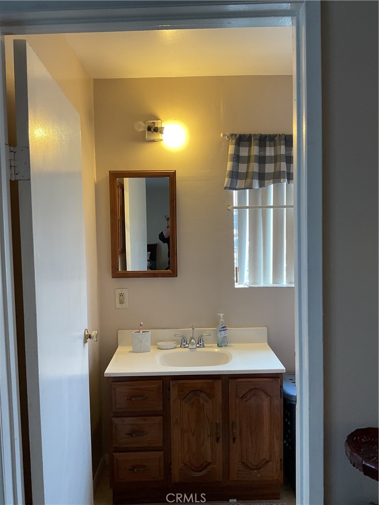 5007 Astor Avenue Commerce, CA 90040 - Photo 32 of 64 a bathroom with a sink and a mirror