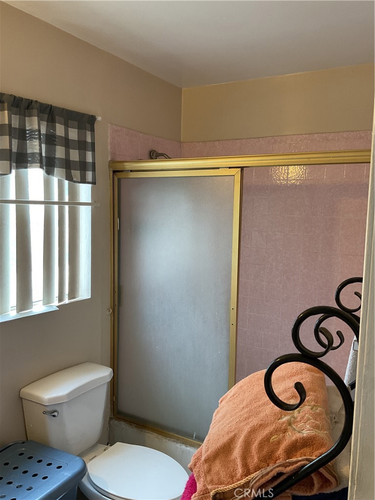 5007 Astor Avenue Commerce, CA 90040 - Photo 34 of 64 a bathroom with a toilet and a sink