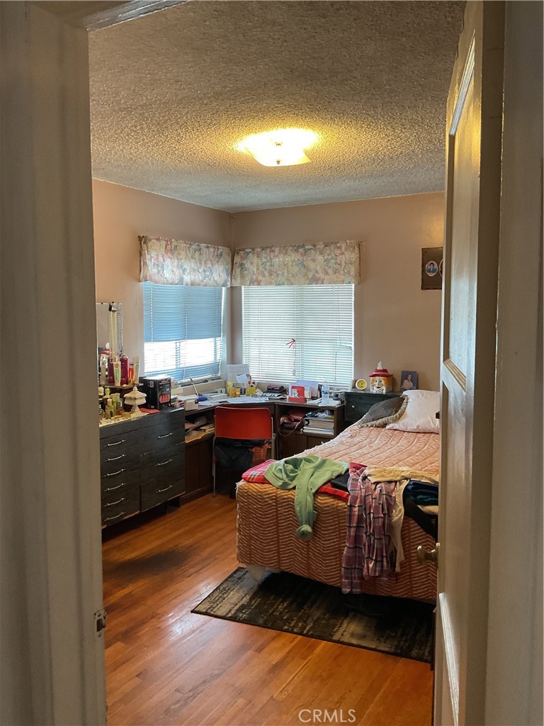 5007 Astor Avenue Commerce, CA 90040 - Photo 35 of 64 a bed room with a bed and a night stand