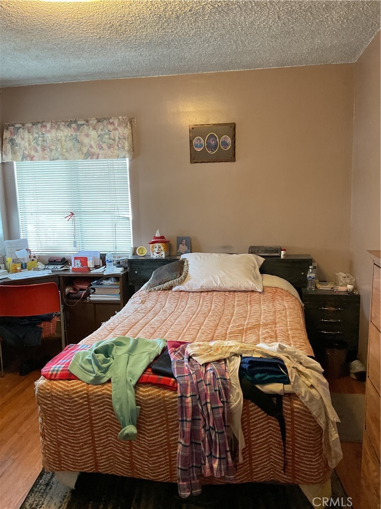 5007 Astor Avenue Commerce, CA 90040 - Photo 37 of 64 a bedroom with a bed and a table