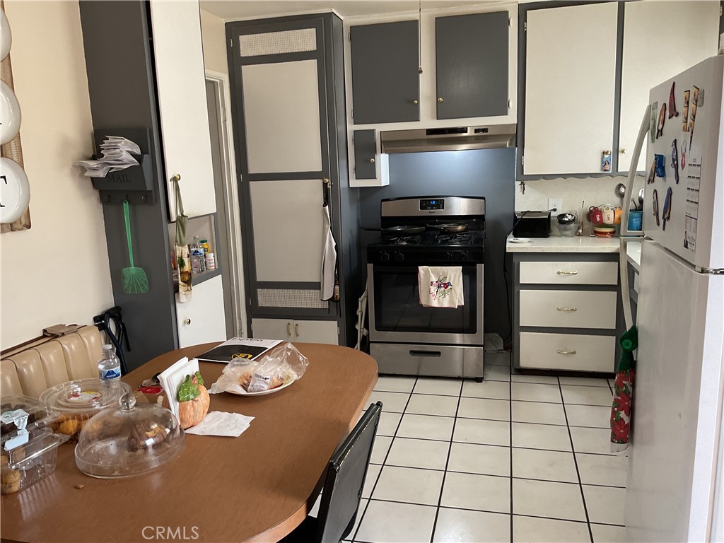 5007 Astor Avenue Commerce, CA 90040 - Photo 41 of 64 a kitchen with stainless steel appliances a stove a refrigerator and a refrigerator