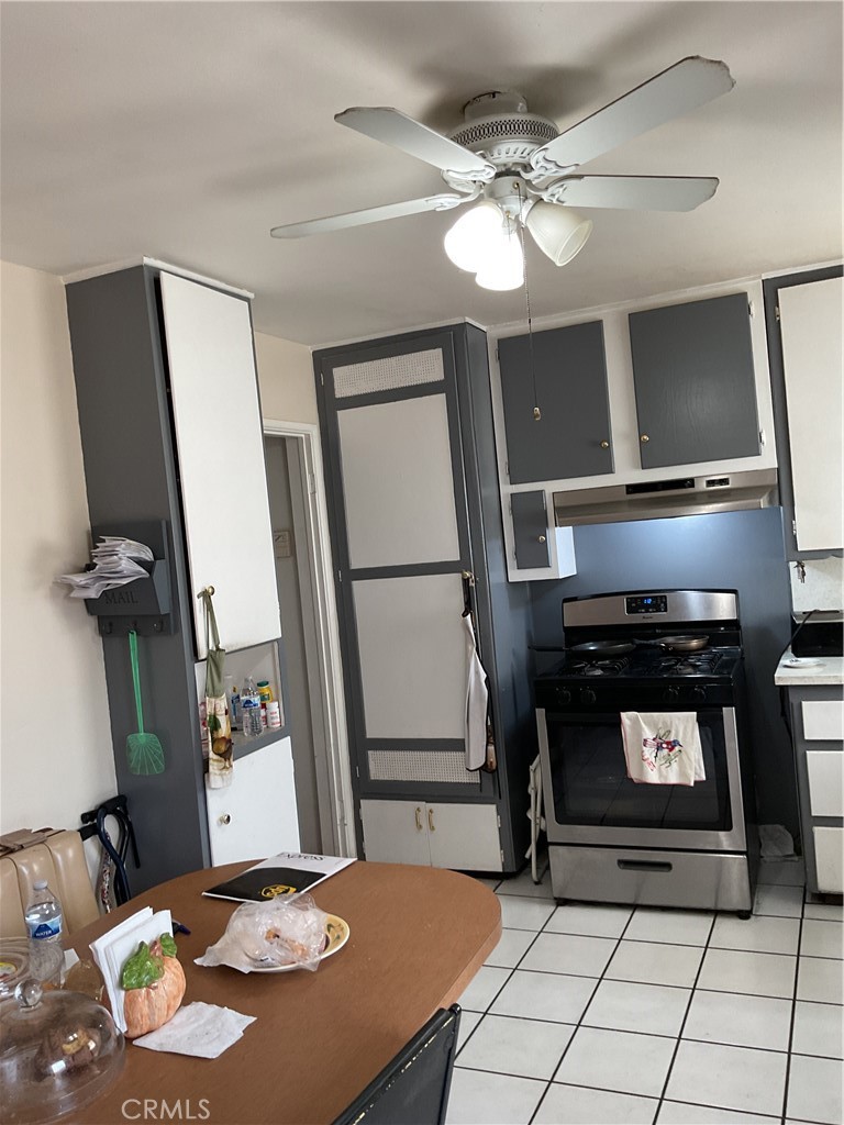 5007 Astor Avenue Commerce, CA 90040 - Photo 45 of 64 a kitchen with a sink a stove and cabinets