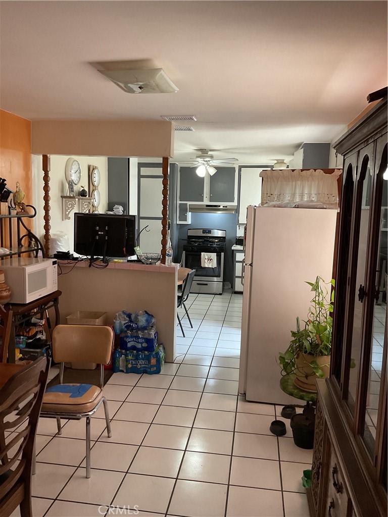 5007 Astor Avenue Commerce, CA 90040 - Photo 47 of 64 a living room with furniture and a large window