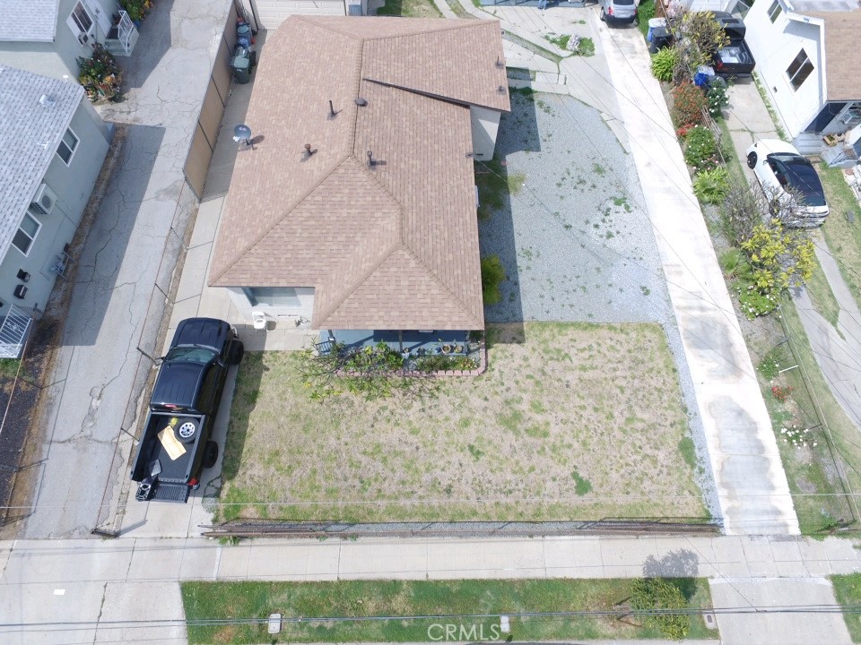 5007 Astor Avenue Commerce, CA 90040 - Photo 62 of 64 an aerial view of a house with a yard and a fountain