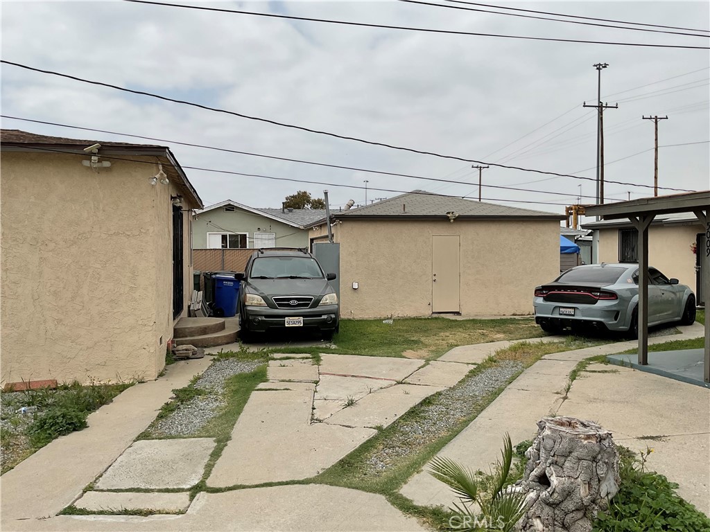5007 Astor Avenue Commerce, CA 90040 - Photo 10 of 64 a view of a garage of car parked