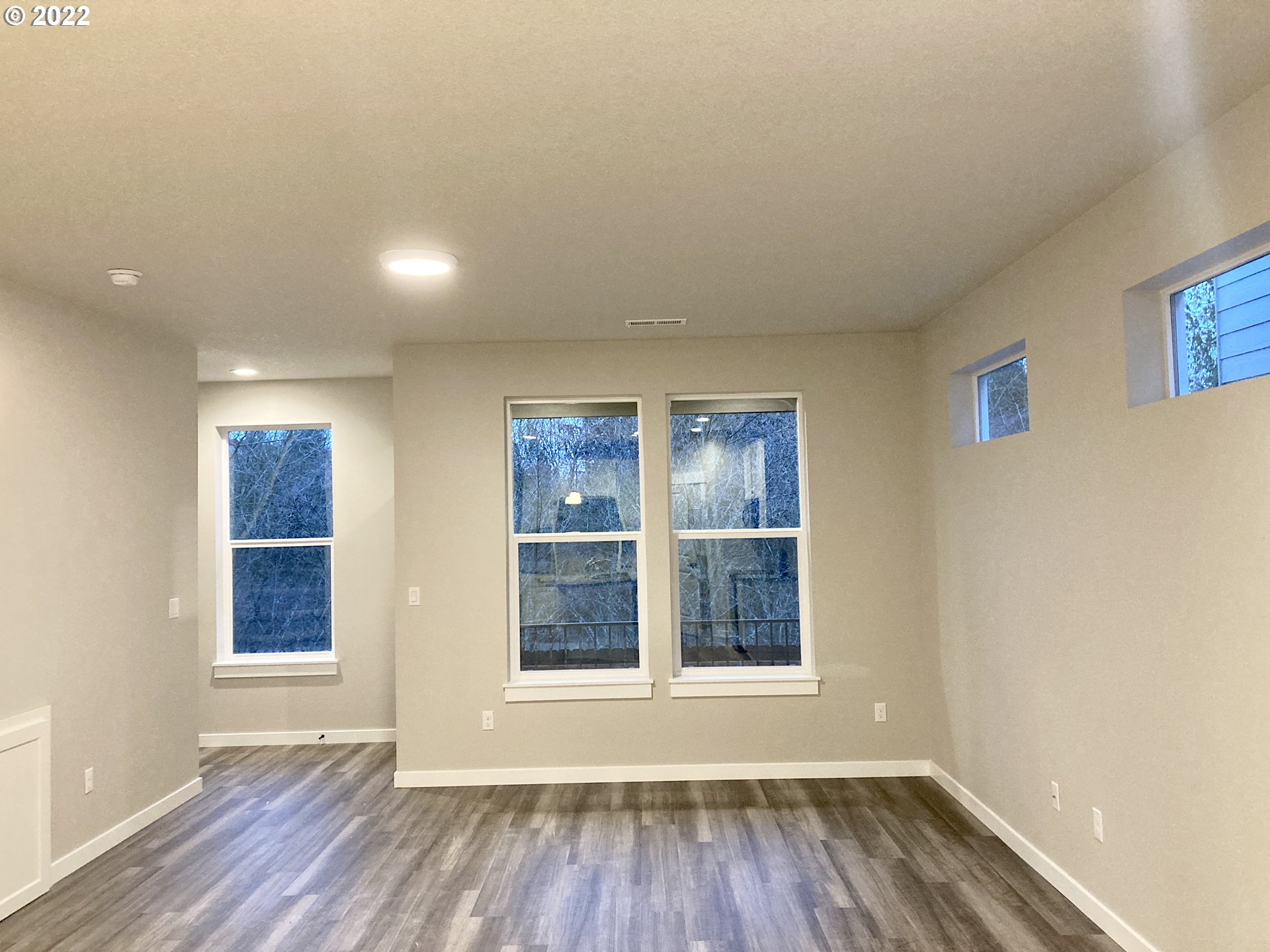 7315 South 13th Street Ridgefield, WA 98642 - Photo 5 of 11 a view of wooden floor and windows in a room