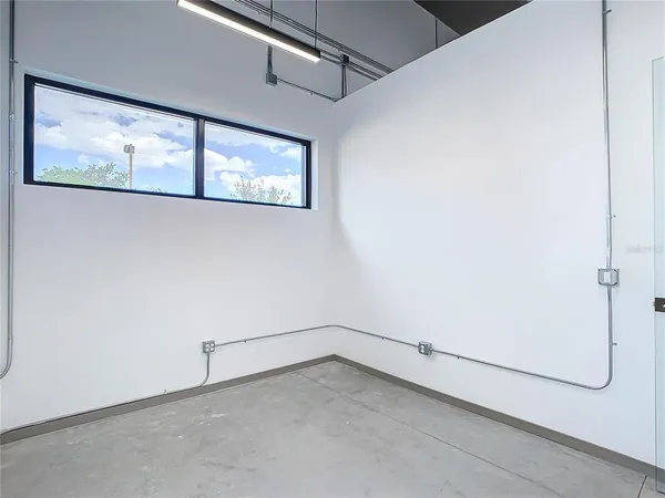a view of an empty room with a window