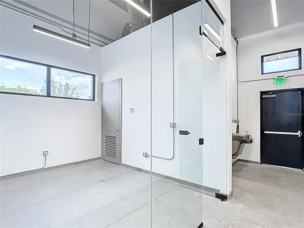 a view of a hallway with a refrigerator